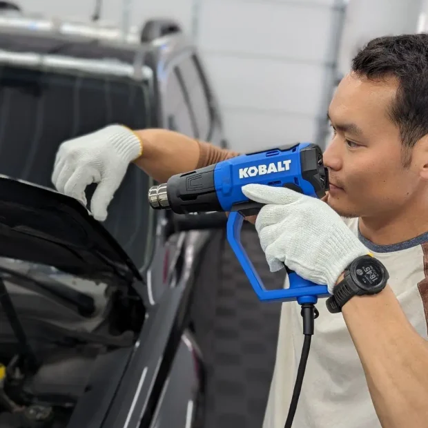 Paint protection film process on hood learn more https://compassautodetail.com/paint-protection-film/